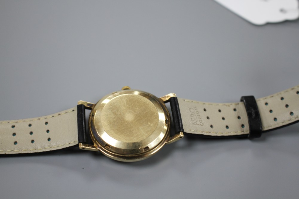 A gentlemans 1960s 9ct gold J.W. Benson automatic wrist watch, on later associated leather strap.